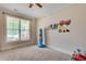 Cozy playroom with a ceiling fan, carpet, and cute transportation-themed wall decorations at 204 Arthur Hills Dr, Acworth, GA 30101