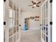 Playroom featuring french doors, neutral carpet, a ceiling fan, and colorful wall decor at 204 Arthur Hills Dr, Acworth, GA 30101