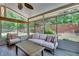 Comfortable sunroom with large windows, neutral furniture and natural light, overlooking the backyard at 204 Arthur Hills Dr, Acworth, GA 30101