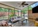 Sunroom with wood floors, ceiling fan, comfortable seating and fenced yard views at 204 Arthur Hills Dr, Acworth, GA 30101
