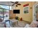 Inviting sunroom with wood-look floors, TV, and a Georgia Bulldogs sign, offering a cozy, relaxing space at 204 Arthur Hills Dr, Acworth, GA 30101