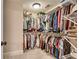 Walk-in closet with metal racks and shelving full of clothing and accessories at 204 Arthur Hills Dr, Acworth, GA 30101