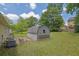 View of a backyard with a storage building in the corner at 2416 Hurt Sw Rd, Marietta, GA 30008