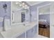 Well-lit bathroom with a white countertop and a view of the primary bedroom at 2416 Hurt Sw Rd, Marietta, GA 30008