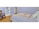 Comfortable bedroom showcasing a lilac color scheme with a view into the en suite bathroom at 2416 Hurt Sw Rd, Marietta, GA 30008