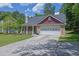 Charming single-Gathering home with well-manicured lawn, flowerbeds, and a two-car garage at 2416 Hurt Sw Rd, Marietta, GA 30008