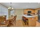 Eat-in kitchen with wood cabinets, stainless steel appliances, and a breakfast bar at 2416 Hurt Sw Rd, Marietta, GA 30008