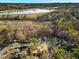 Scenic aerial view of a charming neighborhood with lush trees and a serene lake in the background at 6974 Clearlake Ct, Peachtree Corners, GA 30360