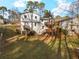 Backyard view of two story home featuring large wooden decks at 6974 Clearlake Ct, Peachtree Corners, GA 30360