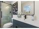 Beautiful bathroom with glass shower, modern vanity, black fixtures, and hexagon-patterned flooring at 6974 Clearlake Ct, Peachtree Corners, GA 30360