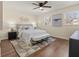 Cozy bedroom with a ceiling fan, plush bedding, and neutral decor for a relaxing ambiance at 6974 Clearlake Ct, Peachtree Corners, GA 30360