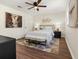 Comfortable bedroom featuring ample natural light, a ceiling fan, and soothing neutral tones at 6974 Clearlake Ct, Peachtree Corners, GA 30360