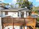 Wooden deck with access to home's interior, overlooking private yard at 6974 Clearlake Ct, Peachtree Corners, GA 30360