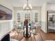 Elegant dining space offering a glass-top table, stylish chairs, and ample natural light at 6974 Clearlake Ct, Peachtree Corners, GA 30360