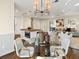 Chic dining area with a glass table, modern lighting, and seamless transition to the living spaces at 6974 Clearlake Ct, Peachtree Corners, GA 30360