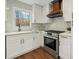 Well-equipped kitchen with white cabinetry, stainless steel appliances, and modern fixtures at 6974 Clearlake Ct, Peachtree Corners, GA 30360