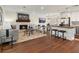 Spacious living area showcases a fireplace, modern seating, and an open flow to the kitchen at 6974 Clearlake Ct, Peachtree Corners, GA 30360