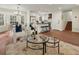 Open living space with hardwood floors, modern decor, and seamless access to the kitchen and dining area at 6974 Clearlake Ct, Peachtree Corners, GA 30360