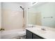 Bathroom featuring a shower-tub combo, black fixtures, and large mirror at 1306 Red Deer Way # 246, Alpharetta, GA 30022