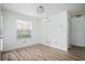 Cozy bedroom with hardwood floors, a closet, and natural light from a window at 1306 Red Deer Way # 246, Alpharetta, GA 30022