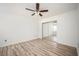 Bright bedroom with wood-look floors and a mirrored closet at 1306 Red Deer Way # 246, Alpharetta, GA 30022