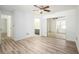 This open bedroom features hardwood floors, mirrored closet, and ensuite bath at 1306 Red Deer Way # 246, Alpharetta, GA 30022