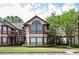 Attractive condo complex showcasing manicured landscaping and traditional architectural style at 1306 Red Deer Way # 246, Alpharetta, GA 30022