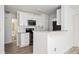 Modern kitchen with white cabinets, stainless steel appliances, and granite countertops at 1306 Red Deer Way # 246, Alpharetta, GA 30022