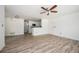 Open living space with hardwood floors, ceiling fan, and an open view to the kitchen at 1306 Red Deer Way # 246, Alpharetta, GA 30022