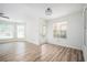 Bright living room with hardwood floors, natural light, and an exterior door at 1306 Red Deer Way # 246, Alpharetta, GA 30022