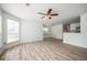 Bright living space featuring a modern ceiling fan, wood-look flooring, and lots of natural light at 1306 Red Deer Way # 246, Alpharetta, GA 30022
