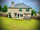 The large backyard has a nice lawn and a deck for relaxing or entertaining guests at 220 Baltimore Ave, Stockbridge, GA 30281