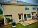 Backyard view of the house featuring the lawn and deck area with outdoor seating at 220 Baltimore Ave, Stockbridge, GA 30281