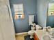 Clean bathroom offers updated fixtures and a vanity with storage space at 220 Baltimore Ave, Stockbridge, GA 30281
