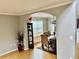 Inviting dining room featuring an arched doorway and neutral color scheme at 220 Baltimore Ave, Stockbridge, GA 30281