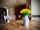 Close-up of a dining table centerpiece with yellow flowers at 220 Baltimore Ave, Stockbridge, GA 30281