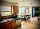 Bright kitchen with stainless appliances, oak cabinets, and adjacent dining area at 220 Baltimore Ave, Stockbridge, GA 30281