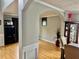 Open-concept view of the home's living spaces with hardwood floors at 220 Baltimore Ave, Stockbridge, GA 30281