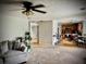 Open-concept living room flows into the kitchen with a breakfast bar and ample seating at 220 Baltimore Ave, Stockbridge, GA 30281