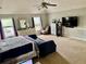 Expansive main bedroom boasts a vaulted ceiling and plenty of natural light at 220 Baltimore Ave, Stockbridge, GA 30281