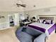 Large primary bedroom offers a vaulted ceiling and comfortable seating area at 220 Baltimore Ave, Stockbridge, GA 30281