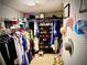 Organized walk-in closet with shelving, hanging rods, and shoe racks for ample storage space at 220 Baltimore Ave, Stockbridge, GA 30281
