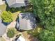 Aerial view of a home with a gray roof, surrounded by lush trees and well-maintained lawns at 4104 Glenaire Nw Way, Acworth, GA 30101
