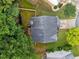 Aerial view of the home showing the roof, backyard, and surrounding trees at 4104 Glenaire Nw Way, Acworth, GA 30101