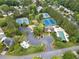 Aerial view of a community with a pool, tennis courts, playground, and landscaped areas at 4104 Glenaire Nw Way, Acworth, GA 30101
