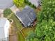 Aerial view of the home's roof, and landscaping with mature trees at 4104 Glenaire Nw Way, Acworth, GA 30101