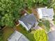 Aerial view of the home showing the roof, fenced backyard, and surrounding trees at 4104 Glenaire Nw Way, Acworth, GA 30101