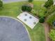 Aerial view shows picnic tables in community green space next to a parking area at 4104 Glenaire Nw Way, Acworth, GA 30101