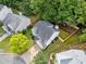 Aerial view of the home with a driveway and mature landscaping at 4104 Glenaire Nw Way, Acworth, GA 30101