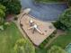 Aerial view of the community playground and parking, surrounded by mature trees at 4104 Glenaire Nw Way, Acworth, GA 30101